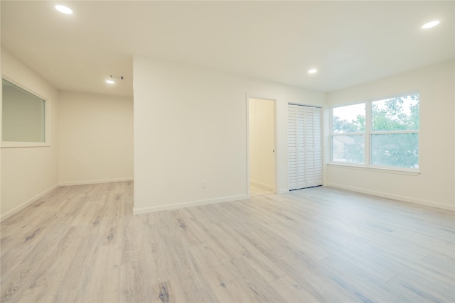 12553 Wellington Park Dr, Houston, TX 77072 - empty room with recessed lighting, light wood finished floors, and baseboards