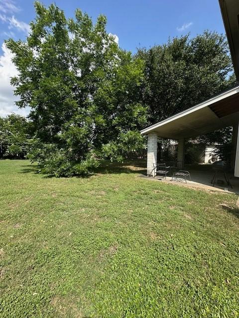 14602 Harcourt Bridge Ct, Houston, TX 77084 - view of green lawn featuring a patio