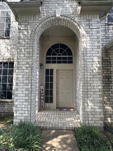 14602 Harcourt Bridge Ct, Houston, TX 77084 - property entrance with brick siding
