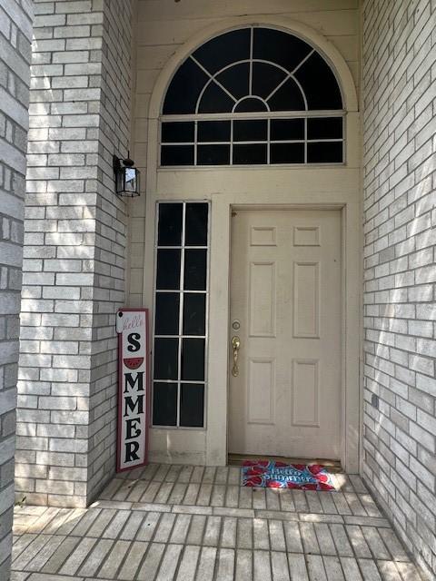 14602 Harcourt Bridge Ct, Houston, TX 77084 - view of exterior entry featuring brick siding