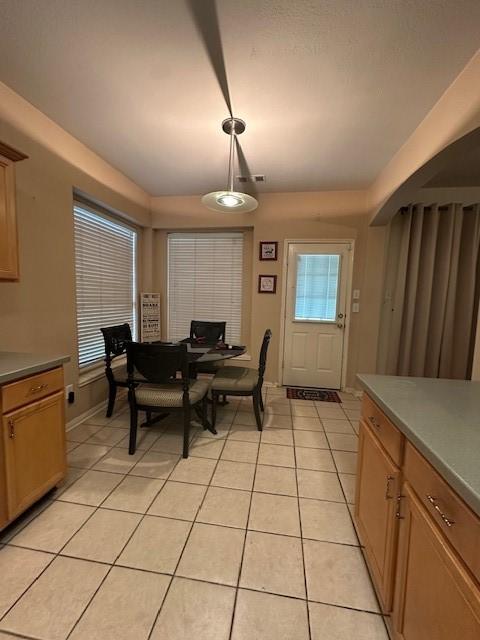 14602 Harcourt Bridge Ct, Houston, TX 77084 - dining room featuring light tile patterned flooring and baseboards