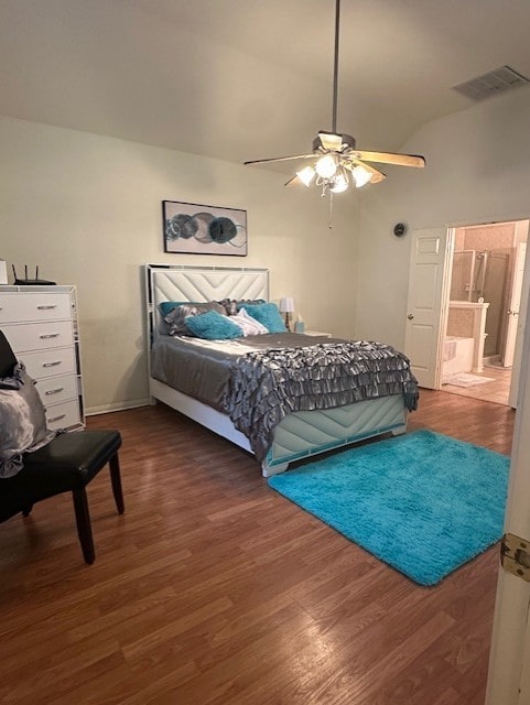 14602 Harcourt Bridge Ct, Houston, TX 77084 - bedroom featuring wood finished floors, vaulted ceiling, a ceiling fan, ensuite bathroom, and baseboards