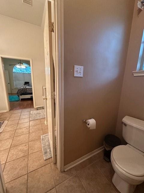 14602 Harcourt Bridge Ct, Houston, TX 77084 - bathroom with toilet, tile patterned floors, and baseboards