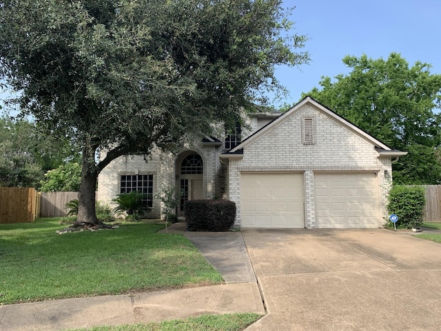 14602 Harcourt Bridge Ct, Houston, TX 77084 - view of front of home with a garage, concrete driveway, and brick siding