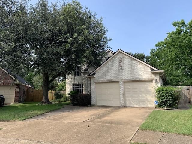 14602 Harcourt Bridge Ct, Houston, TX 77084 - view of front of house featuring concrete driveway, brick siding, and an attached garage