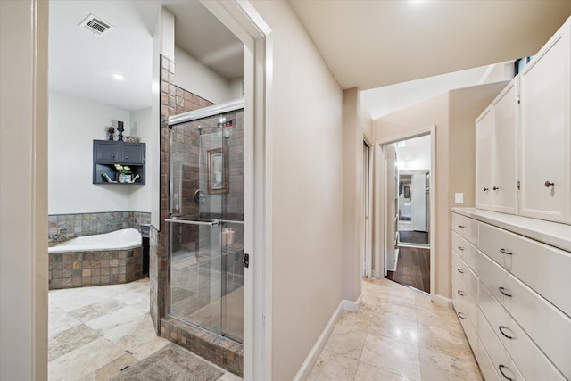 14111 Decker Dr, Magnolia, TX 77355 - bathroom with a garden tub, a shower stall, baseboards, and vanity