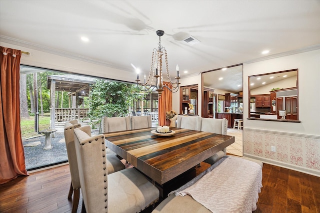 14111 Decker Dr, Magnolia, TX 77355 - dining room featuring crown molding, a chandelier, baseboards, wood finished floors, and recessed lighting