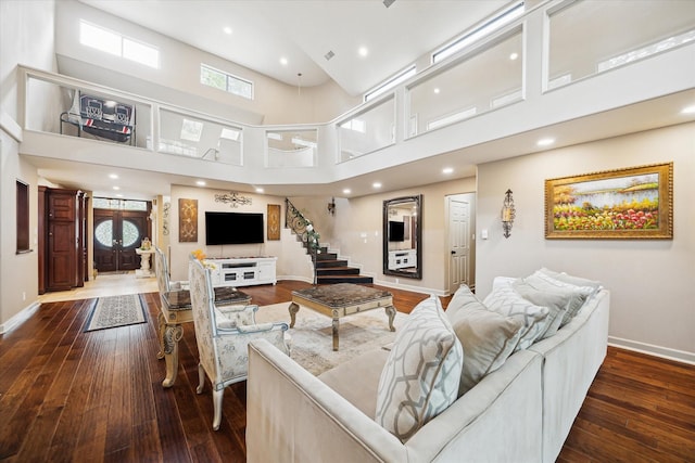 14111 Decker Dr, Magnolia, TX 77355 - living room with baseboards, a towering ceiling, dark wood-type flooring, and recessed lighting