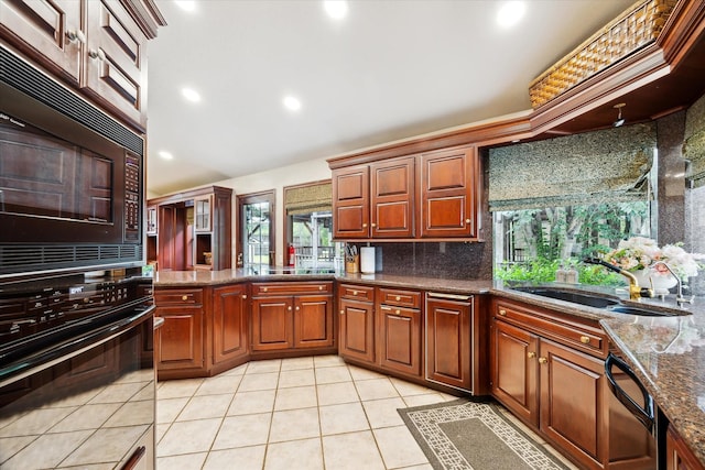 14111 Decker Dr, Magnolia, TX 77355 - kitchen featuring black appliances, a sink, tasteful backsplash, light tile patterned flooring, and dark stone countertops
