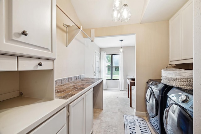 14111 Decker Dr, Magnolia, TX 77355 - laundry area featuring cabinet space, independent washer and dryer, and light tile patterned floors