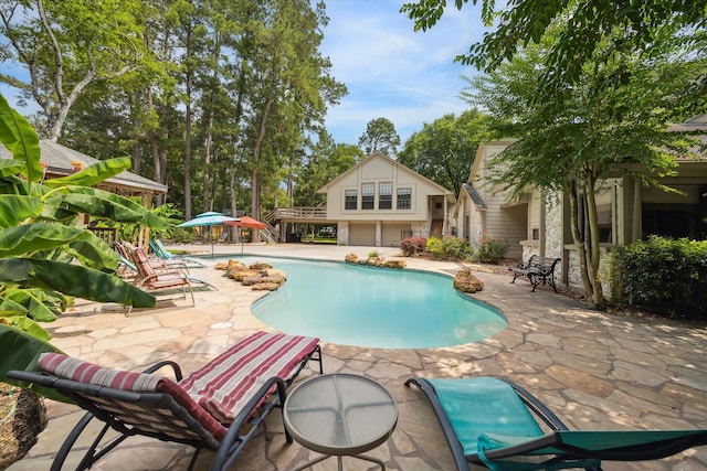 14111 Decker Dr, Magnolia, TX 77355 - swimming pool featuring a patio