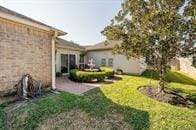 722 Silver Creek Cir, Richmond, TX 77406 - view of grassy yard featuring a patio area