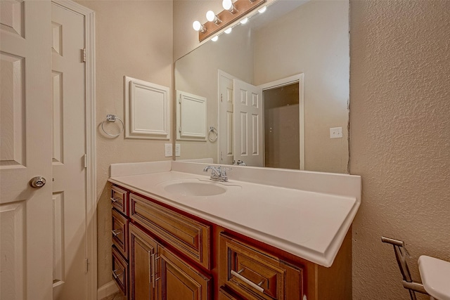 722 Silver Creek Cir, Richmond, TX 77406 - bathroom with vanity and a textured wall