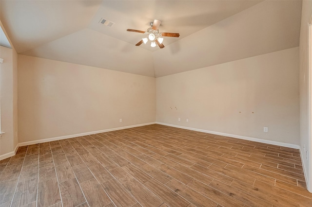 722 Silver Creek Cir, Richmond, TX 77406 - additional living space with a ceiling fan, wood finished floors, vaulted ceiling, and baseboards