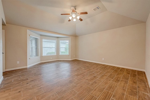722 Silver Creek Cir, Richmond, TX 77406 - spare room featuring a ceiling fan, light wood-style flooring, vaulted ceiling, and baseboards