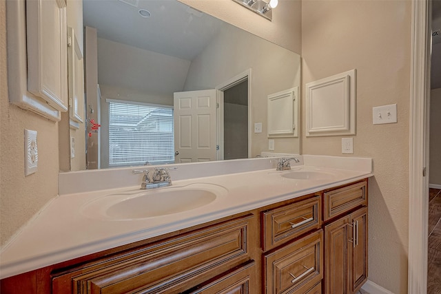 722 Silver Creek Cir, Richmond, TX 77406 - bathroom featuring double vanity and vaulted ceiling