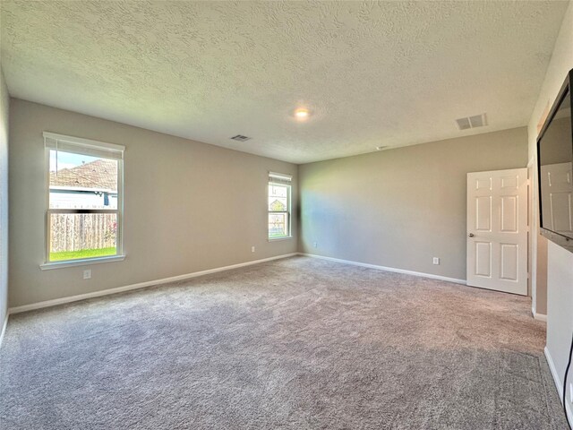 2115 Katalonia Ln, Fresno, TX 77545 - carpeted spare room featuring a textured ceiling and baseboards