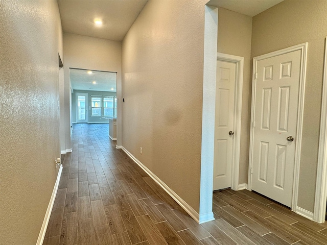 2115 Katalonia Ln, Fresno, TX 77545 - hallway with wood finish floors, a textured wall, and baseboards