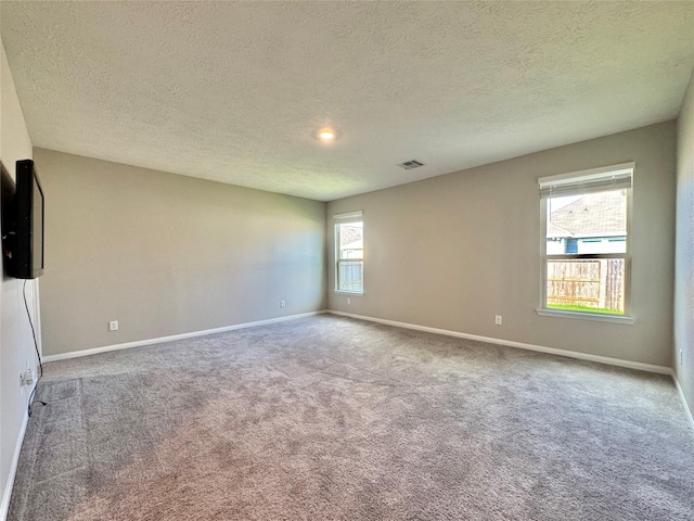 2115 Katalonia Ln, Fresno, TX 77545 - carpeted empty room with a textured ceiling and baseboards
