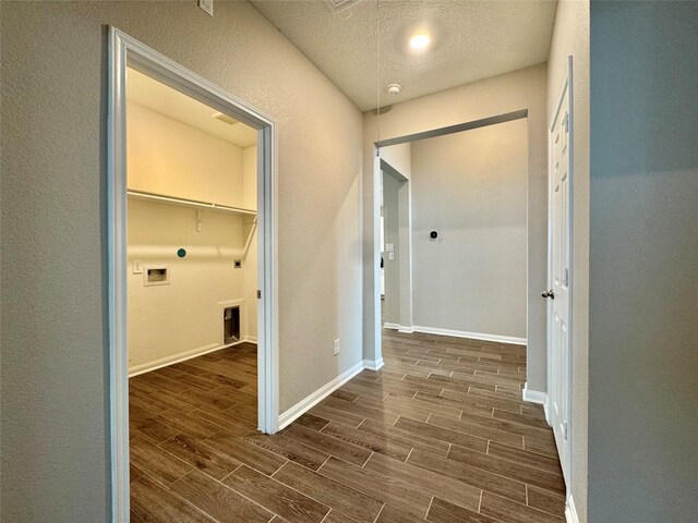 2115 Katalonia Ln, Fresno, TX 77545 - washroom with dark wood finished floors, electric dryer hookup, hookup for a washing machine, baseboards, and gas dryer hookup