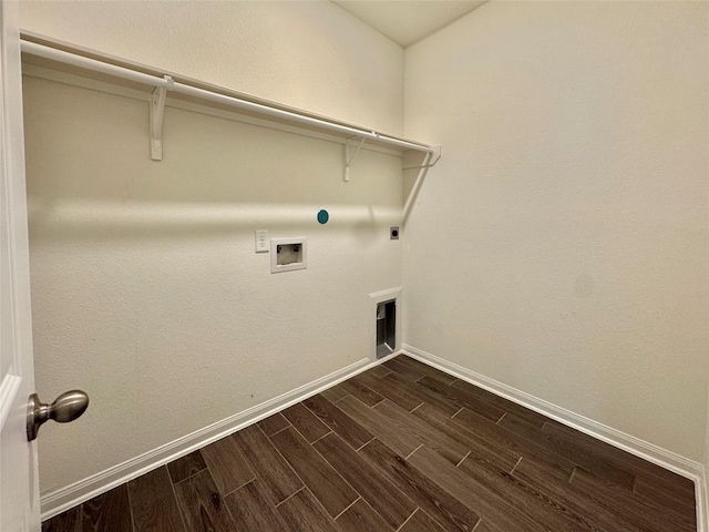 2115 Katalonia Ln, Fresno, TX 77545 - laundry room featuring dark wood finished floors, washer hookup, hookup for an electric dryer, baseboards, and hookup for a gas dryer