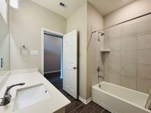 2115 Katalonia Ln, Fresno, TX 77545 - full bathroom with wood finish floors, vanity, shower / washtub combination, and baseboards