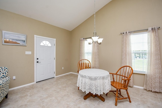880 Swallow Dr, Palacios, TX 77465 - dining area with a chandelier, high vaulted ceiling, and light tile patterned floors
