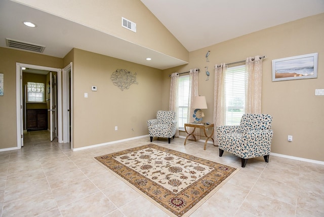 880 Swallow Dr, Palacios, TX 77465 - sitting room featuring light tile patterned flooring, lofted ceiling, and recessed lighting