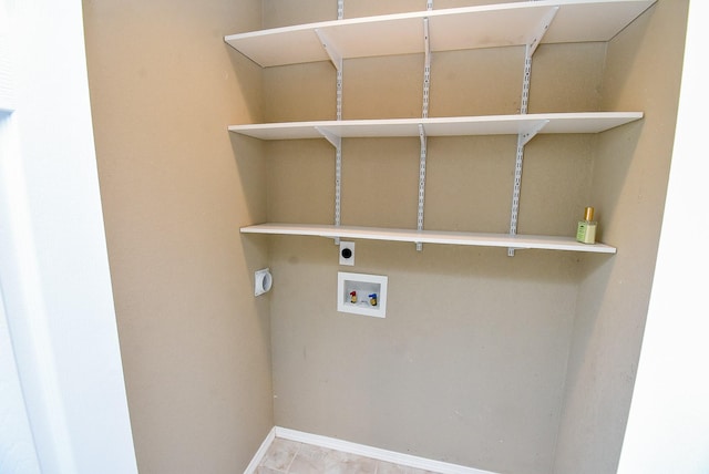 880 Swallow Dr, Palacios, TX 77465 - laundry room featuring electric dryer hookup and hookup for a washing machine