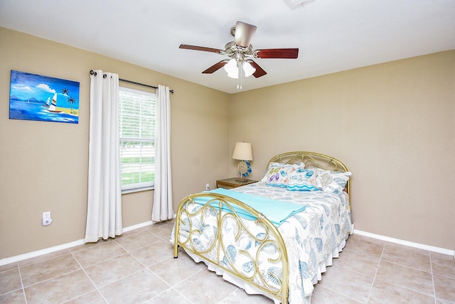 880 Swallow Dr, Palacios, TX 77465 - bedroom with tile patterned flooring and a ceiling fan