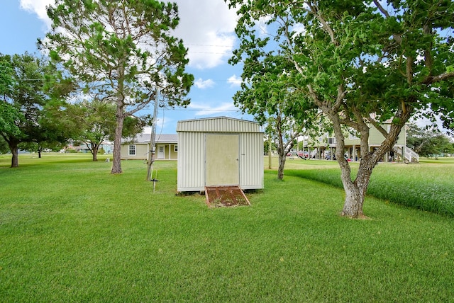 880 Swallow Dr, Palacios, TX 77465 - view of grassy yard featuring a shed
