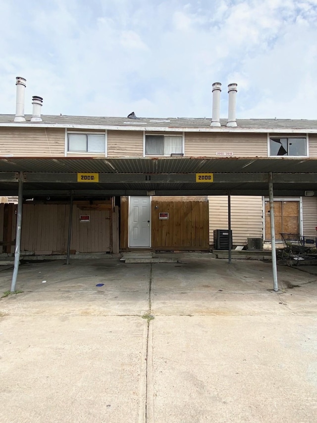 8323 Wilcrest Dr Unit 2006, Houston, TX 77072 - view of building exterior featuring covered parking and central air condition unit