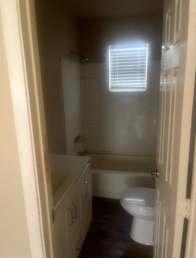 3207 Stella Rd, Brookshire, TX 77423 - full bathroom with washtub / shower combination, toilet, vanity, and wood finished floors