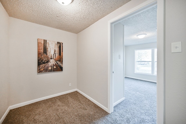 9306 Chesterfield Dr, Houston, TX 77051 - empty room with a textured ceiling, carpet floors, and baseboards