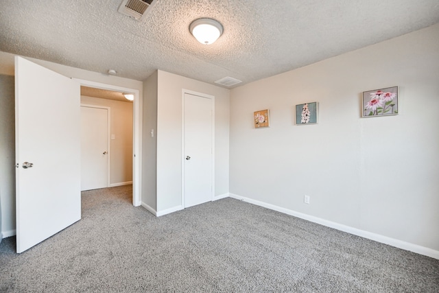 9306 Chesterfield Dr, Houston, TX 77051 - unfurnished bedroom featuring carpet, a textured ceiling, baseboards, and a closet