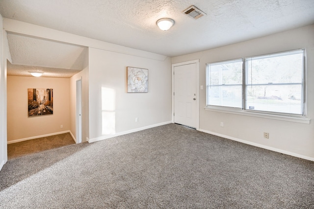 9306 Chesterfield Dr, Houston, TX 77051 - carpeted spare room with a textured ceiling and baseboards