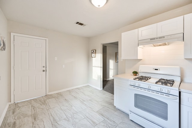 9306 Chesterfield Dr, Houston, TX 77051 - kitchen featuring white range with gas cooktop, under cabinet range hood, light countertops, white cabinets, and baseboards