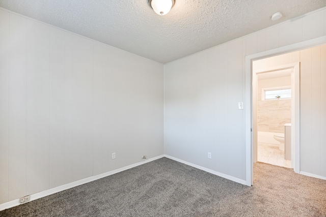 9306 Chesterfield Dr, Houston, TX 77051 - carpeted empty room featuring a textured ceiling and a smoke detector
