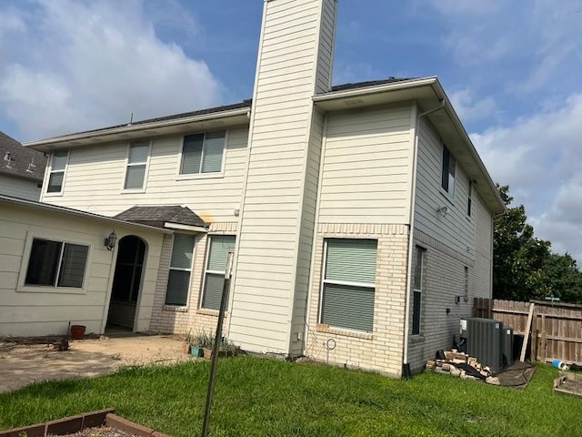 6603 Golden View Ct, Houston, TX 77083 - back of property featuring a chimney, central AC, and brick siding