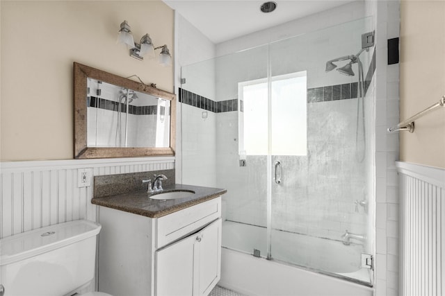809 University Blvd, Galveston, TX 77550 - full bathroom featuring enclosed tub / shower combo, vanity, a wainscoted wall, and toilet