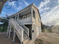 801 University Blvd, Galveston, TX 77550 - rear view of house with a garage
