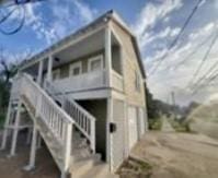 801 University Blvd, Galveston, TX 77550 - rear view of house with stairs