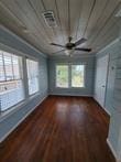801 University Blvd, Galveston, TX 77550 - empty room with a ceiling fan, baseboards, wood finished floors, and wooden ceiling