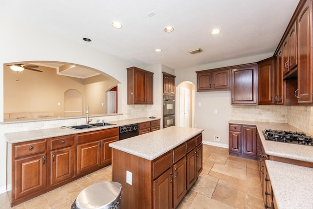 12515 Country Arbor Ln, Houston, TX 77041 - kitchen with a sink, black appliances, arched walkways, a center island, and backsplash