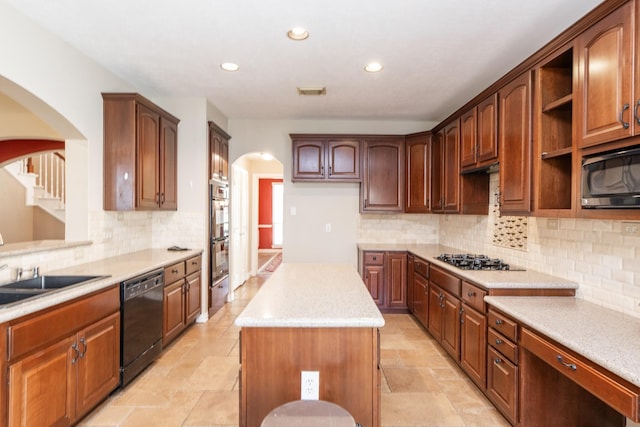 12515 Country Arbor Ln, Houston, TX 77041 - kitchen featuring dishwasher, built in microwave, arched walkways, gas cooktop, and recessed lighting