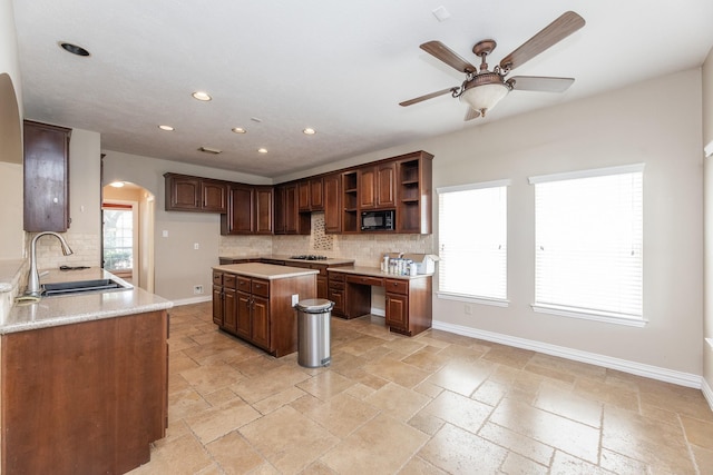 12515 Country Arbor Ln, Houston, TX 77041 - kitchen with arched walkways, black microwave, a sink, open shelves, and decorative backsplash