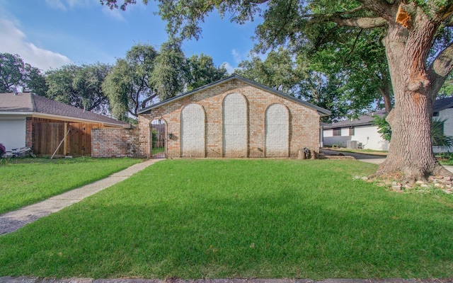 8406 Beechaven Rd, Houston, TX 77571 - view of front of house featuring brick siding, central AC, and a gate