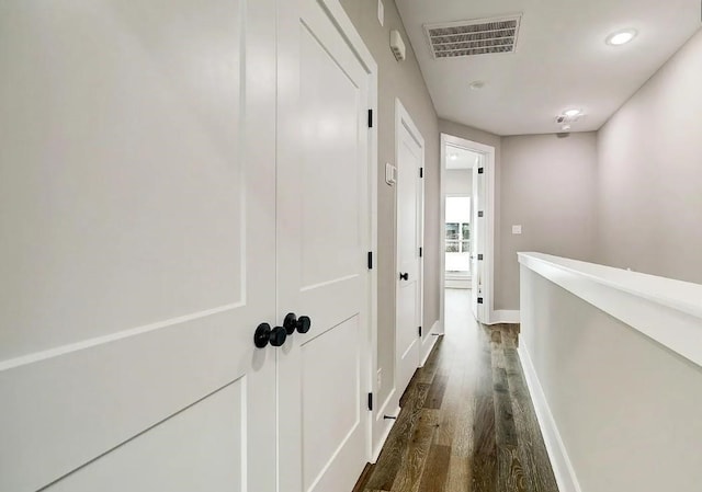 1407 W 23rd St, Houston, TX 77008 - hallway with dark wood-type flooring, baseboards, an upstairs landing, and recessed lighting