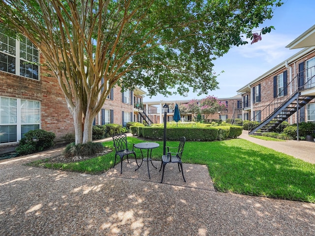 6402 Del Monte Dr Unit 20, Houston, TX 77057 - view of property's community with stairs and a lawn