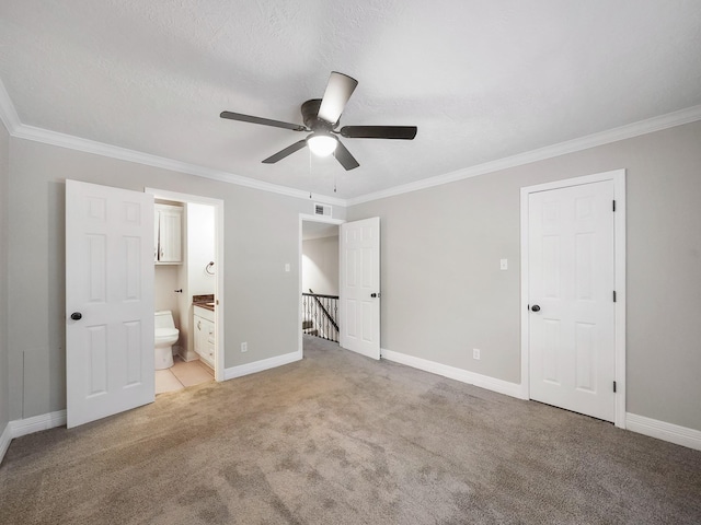 6402 Del Monte Dr Unit 20, Houston, TX 77057 - unfurnished bedroom with crown molding, baseboards, light carpet, ensuite bathroom, and ceiling fan